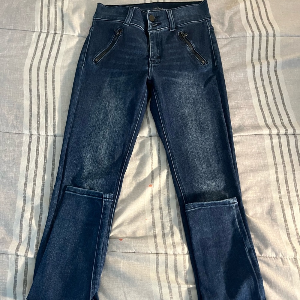 Soho dark jeans, with zipper pockets, gently worn.